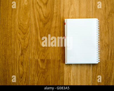 Empty notebook on wooden vintage table with copy space Stock Photo