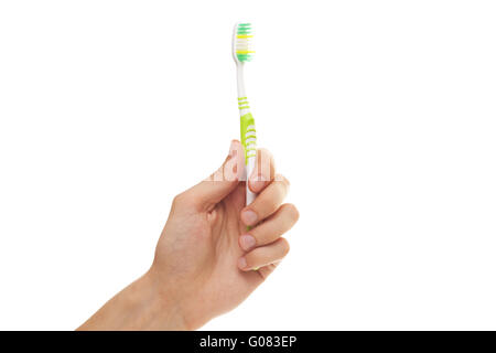 hand with green tooth brushe isolated over white b Stock Photo