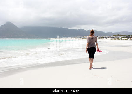 Beach of Kommetjie with an upcoming storm in the background Stock Photo