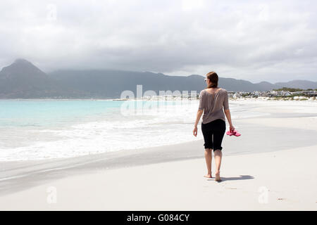 Beach of Kommetjie with an upcoming storm in the background Stock Photo
