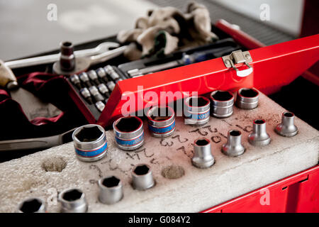 Socket wrench set in car garage. Stock Photo