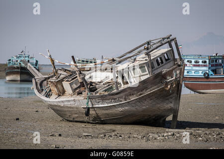 Old abandoned wooden boat in Bandare Loft village on Qeshm island, Iran Stock Photo