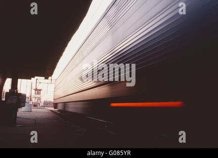 Pan blur motion view of SEPTA commuter train car leaving station Stock Photo