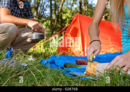 Hiking Picnic Young Couple cooking Meal Stock Photo