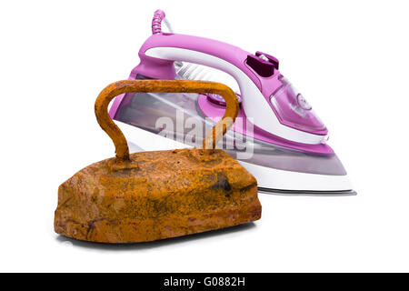 Old rusty pig-iron iron and modern new electric ir Stock Photo