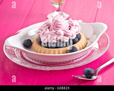 Blueberry cake with whipped cream and fresh bluebe Stock Photo
