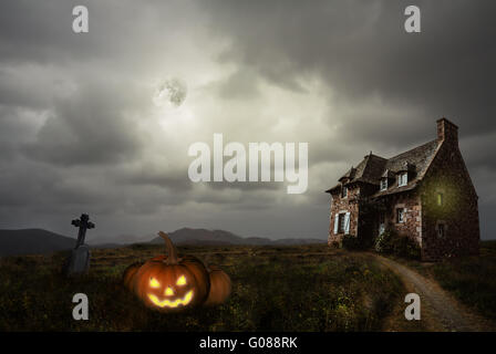 Apocalyptic Halloween scenery with old house pumpkin Stock Photo