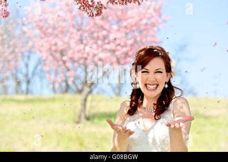 Bride is Showered in Cherry Blossoms Stock Photo