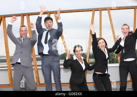 Successful business team cheering and rejoicing Stock Photo