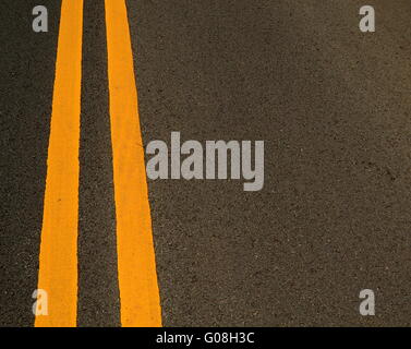 Double Yellow Marking Lines On A Road With Copy Space Stock Photo