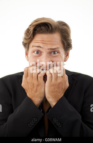 Businessman chewing on his fingernails with a worr Stock Photo