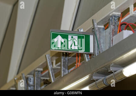 Emergency exit sign in construction site an industrial plant Stock Photo