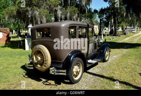 New Bern, North Carolin:  A vintage 1929 Model A Ford sightseeing vehicle taking visitors for a tour of Cedar Grove Cemetery Stock Photo