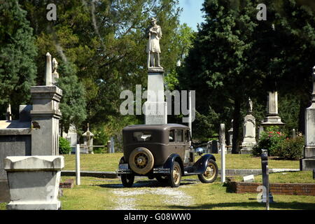 New Bern, North Carolina:  A vintage 1929 Model A Ford sightseeing vehicle taking visitors for a tour of Cedar Grove Cemetery Stock Photo