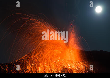 Huge Full moon eruption volcano Stromboli erupting Stock Photo