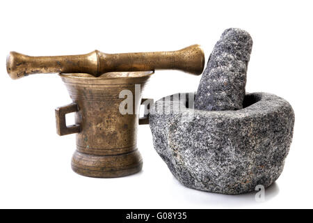 Granite and brass mortar with pestles on a white background Stock Photo