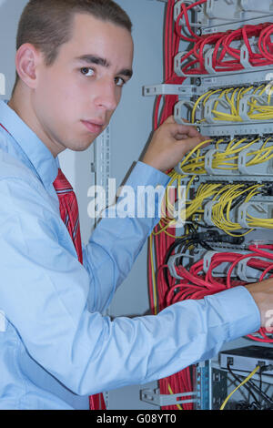 young adult working on a server Stock Photo