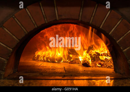 Fire wood burning in the oven Stock Photo