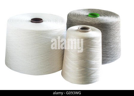Linen and silk yarn bobbins isolated on white back Stock Photo