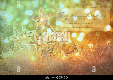 Star holiday lights with gold sparkle background Stock Photo