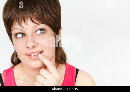 Curious young attractive girl. close-up portrait Stock Photo