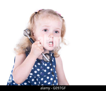 curly-haired little girl with a vintage telephone Stock Photo