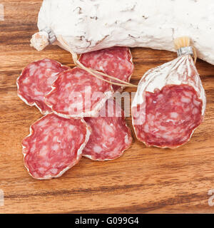 salami sausage on wooden background Stock Photo