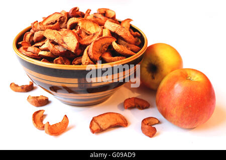 dried apples in the plate isolated on the white Stock Photo
