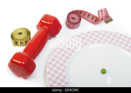 Plate with one peas. Dumbbell and centimeter measure. Stock Photo