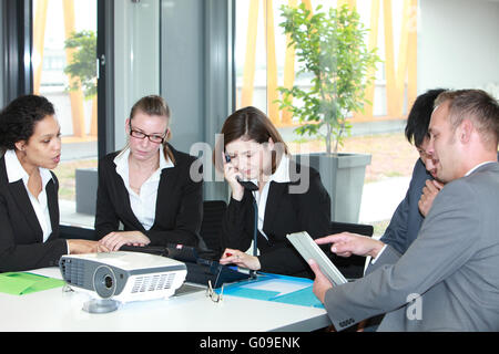 Group of young business professionals in a meeting Stock Photo