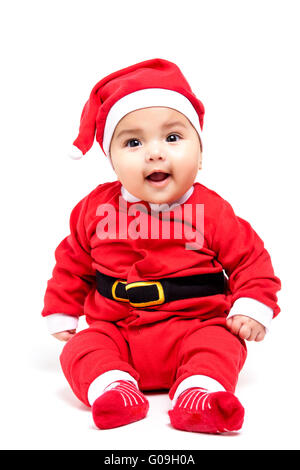 Little  baby girl  in red Christmas clothes. Stock Photo