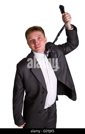 man pulling necktie out to choke himself while making facial expression Stock Photo
