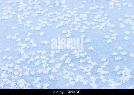 background ice on the frozen pond with snowflakes abstract form Stock Photo