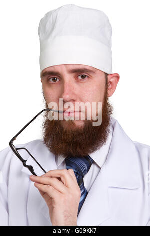 Studio portrait of a young bearded doctor in glasses Stock Photo