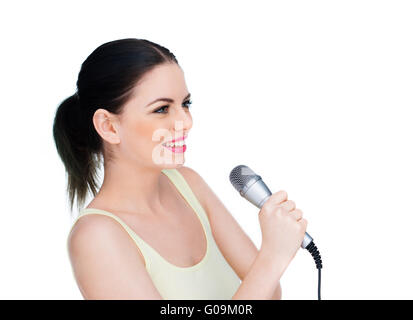 Beautiful young woman holding a microphone Stock Photo