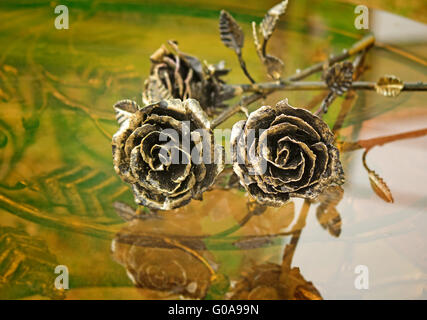 The shiny metal forged roses, handmade Stock Photo