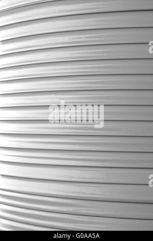 Fiber optic cable on the cable drum monochrome Stock Photo