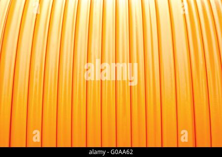 Background fiber optic cable on the cable drum Stock Photo