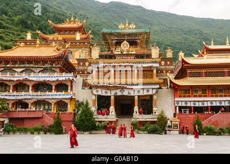 Kangding, Sichuan province, China - The view of Namo monastery, a famous Tibetan Buddhism Temple with some monks in the daytime. Stock Photo