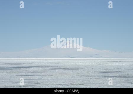 mountain peak is covered with white snow in Antarctica Stock Photo