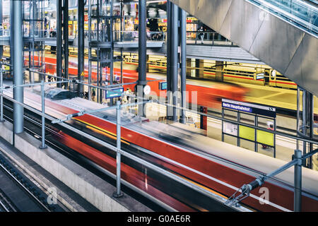 Two trains at Berlin's main train station Stock Photo