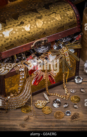 Open treasure chest full of jewellery Stock Photo