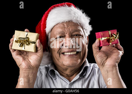 Smiling Aged Man Holding Two Small Xmas Gifts Stock Photo