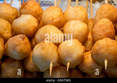 The close up of Taiwanese fried fish balls on stick at food street market in Taipei, Taiwan. Stock Photo