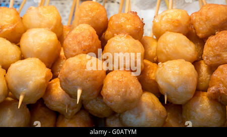 The close up of Taiwanese fried fish balls on stick at food street market in Taipei, Taiwan. Stock Photo