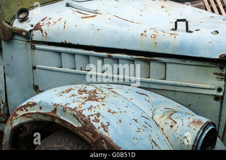 Wheel, rusty mud-guard and car hood of vintage car Stock Photo