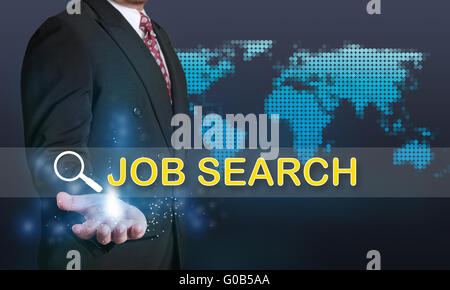 Business concept image of a businessman showing Job Search words on his hand over blue background with dotted world map Stock Photo
