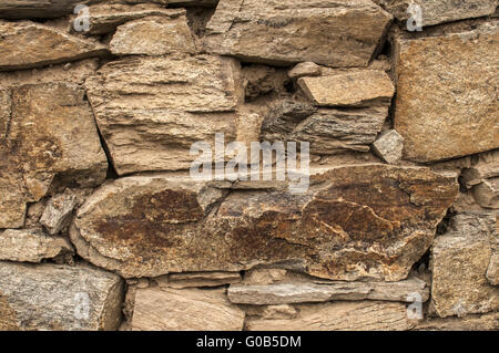 Dry masonry stone wall closeup as background Stock Photo