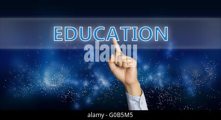 Education concept image of a businessman hand clicking Education button on virtual screen over space background Stock Photo