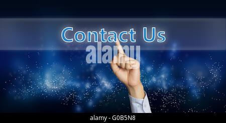 Business concept image of a businessman hand clicking Contact Us button on virtual screen over space background Stock Photo